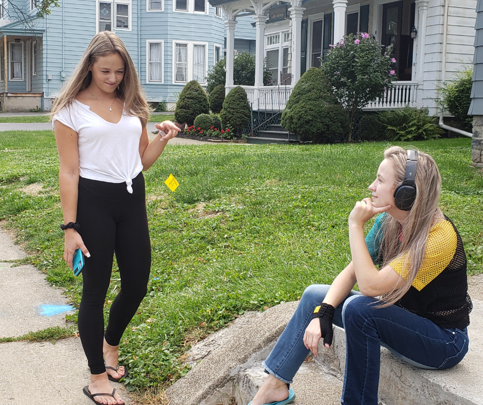 a girl attempting to talk to another girl