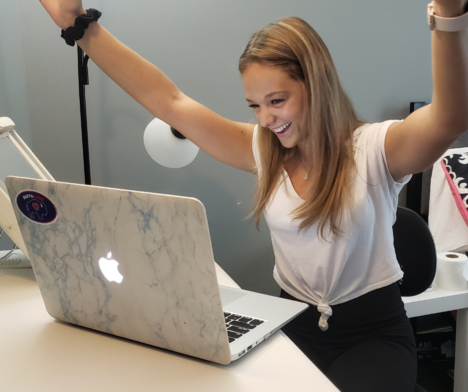 a girl excited about her computer