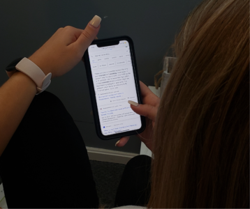 a girl searching on a phone "internet not working"