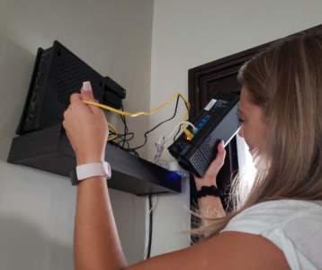 a girl messing around with the router