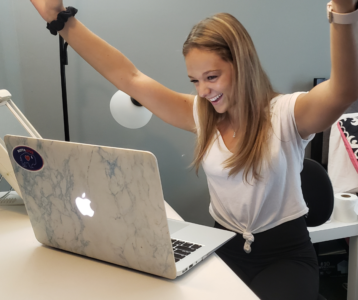 a girl excited about her computer