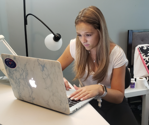 a girl feeling sad on her computer